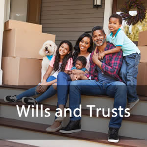 Wills and Trusts - An African American family with some boxes sitting on stairs